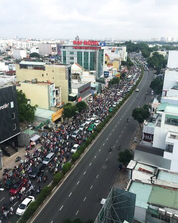 Saigon, Vietnam - Aug 5, 2019. Rush hours on main street. In Ho Chi Minh City (Saigon), rush hour traffic is compounded by 7 million motorbikes zipping through the city.のeditorial素材