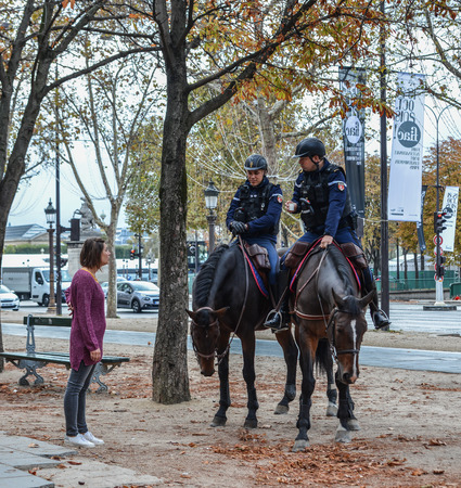 Paris, France - Oct 2, 2018. Gendarmes on horseback in Paris, France. The National Gendarmerie is one of two national police forces of France.のeditorial素材