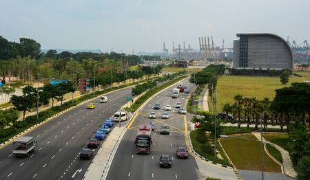 Singapore - Jul 4, 2015. Highway at business district in Singapore. Singapore is a global financial center with a tropical climate and multicultural population.の写真素材