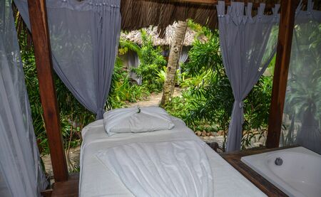 Massage table with towel at the place to relax in modern wellness centre.の写真素材