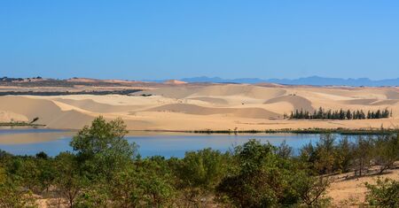 Amazing shape on Vietnamese sand hill with the lake at Bau Trang, Mui Ne, Vietnam.の写真素材