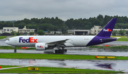Tokyo, Japan - Jul 4, 2019.  N879FD 777-F taxiing on runway of Tokyo Narita Airport (NRT). Narita is...