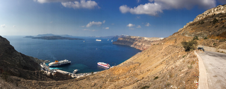 Santorini, Greece - Oct 10, 2018. Aerial view of modern luxury tourist cruise ship in the bay of Santorini, Greece.のeditorial素材