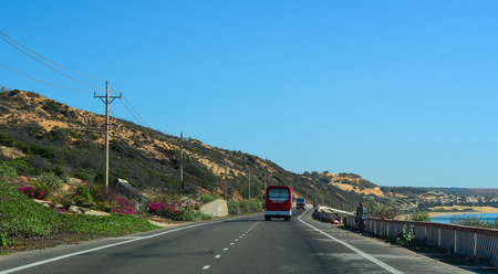 Phan Thiet, Vietnam - Mar 20, 2016. Highway at summer day in Phan Thiet, Vietnam. The total length of the Vietnam road system is about 222,179 km.のeditorial素材