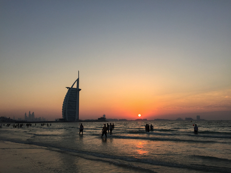 Dubai, UAE - Dec 7, 2018. Burj Al Arab Hotel with the beach at sunset in Dubai, UAE. The hotel stands on an artificial island 280m from Jumeirah Beach.のeditorial素材