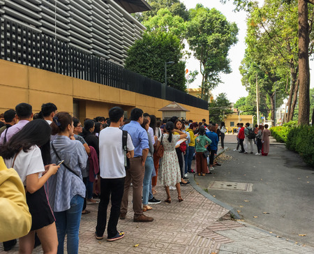 Saigon, Vietnam - Mar 6, 2019. People line up outside the Embassy of Japan for consular services in...