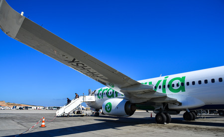 Santorini, Greece - Oct 8, 2018. A 737-800 airplane of Transavia docking at Santorini Airport (JTR). Santorini is one of famous destinations in the world.のeditorial素材