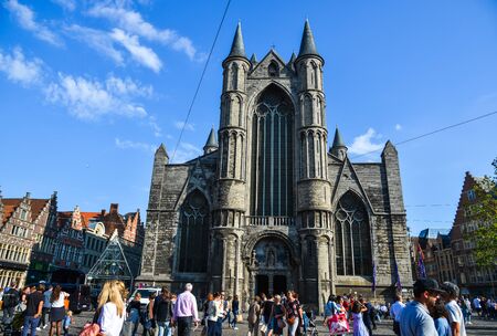 Ghent, Belgium - Oct 6, 2018. Tourists at old town of Ghent, Belgium. Ghent is the Belgium most beautiful city, rich in history, and attracting tourists.の写真素材