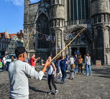 Ghent, Belgium - Oct 6, 2018. Tourists at old town of Ghent, Belgium. Ghent is the Belgium most...
