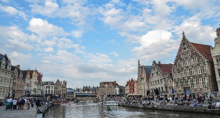 Ghent, Belgium - Oct 6, 2018. View of Ghent cityscape with Leie River. Ghent is the Belgium most beautiful city, rich in history, and attracting tourists.の写真素材
