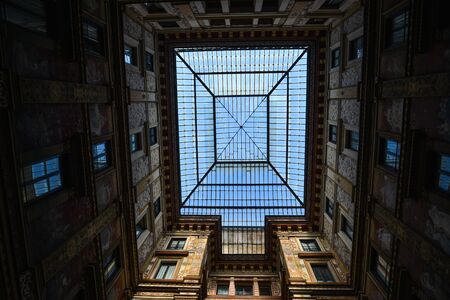 Roman old beautiful house with sculptures and decorations on ancient building in historic old town in Rome, Italy.の写真素材