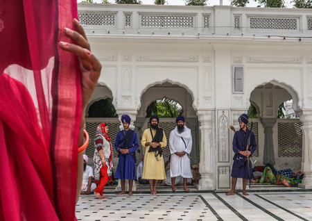 Amritsar, India - Jul 25, 2015. Prayers at the Golden Temple (Harmandir Sahib) in Amritsar, Punjab, India. The temple is most sacred icon and worship place of Sikh religion.のeditorial素材