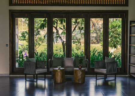 Quy Nhon, Vietnam - Oct 4, 2019. Modern living room with garden view of luxury resort in summer day. Quy Nhon has a 42km long coastline with beautiful beaches.のeditorial素材