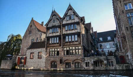 Bruges, Belgium - Oct 5, 2018. Cityscape of Old Bruges with the canal in sunny day. Bruges is a medieval fairy-tale town and Belgium most visited city with 7.8 million people every year.のeditorial素材