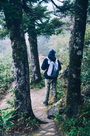 A man hiking on Hakkoda Mountains in Aomori, Japan. Hakkoda is one of the best fall destinations in the Tohoku region.の写真素材