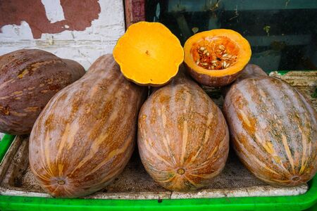 Slice of yellow pumpkin at rural market in Hunan, China.の写真素材