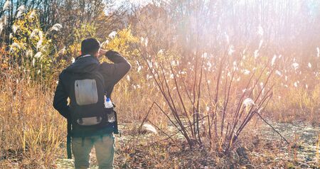 Aomori, Japan - Nov 4, 2019. Asian man traveler enjoying autumn forest in Hakkoda Mountains, Aomori,...