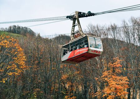 Aomori, Japan - Nov 4, 2019. Hakkoda Ropeway with autumn trees in sunny day. The 2.5km ropeway offers superb views of the natural scenery of the Hakkoda Mountain.のeditorial素材