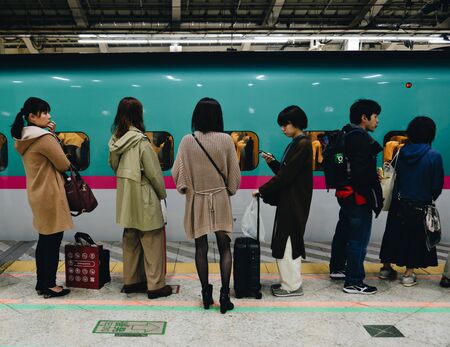 Tokyo, Japan - Nov 3, 2019. Passengers waiting for Shinkansen train at JR Station in Tokyo, Japan. High speed trains (bullet trains) called Shinkansen and operated by Japan Railways.のeditorial素材