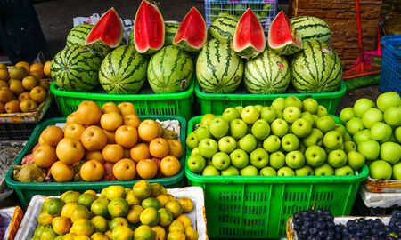 Sichuan, China - Aug 16, 2016. Various colorful fresh fruits at rural market in Chengdu, Sichuan Province, China.のeditorial素材