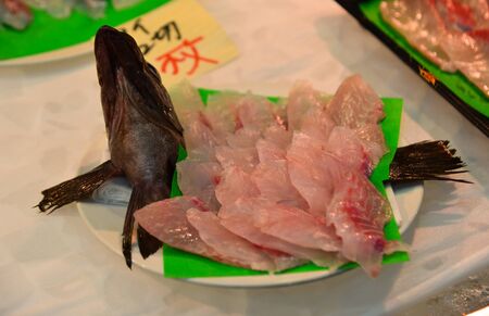 Aomori, Japan - Nov 4, 2019. Small trays of fish and other seafood to make nokkedon or sashimi at traditional Furukawa Fish Market in Aomori, Japan.のeditorial素材