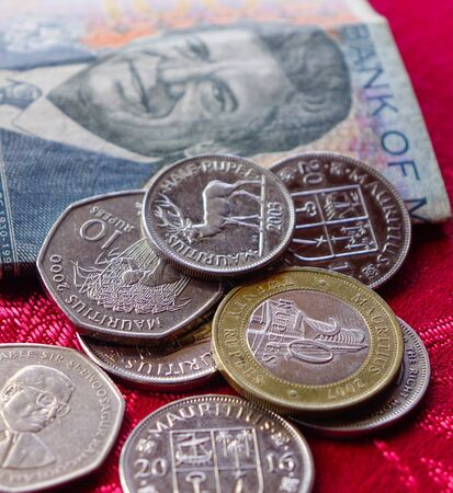 Mauritian rupee bill note with coins. The currency code for Rupees is MUR, and the currency symbol is â¨.の写真素材