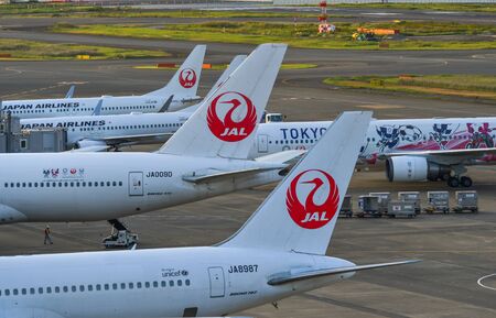 Tokyo, Japan - Nov 2, 2019. Group of JAL airplanes docking at Tokyo Haneda Airport (HND). Haneda was...