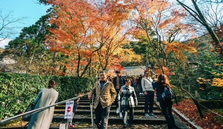 Kyoto, Japan - Nov 28, 2016. People enjoying autumn leaves (momiji) at ancient temple in Kyoto, Japan. Kyoto served as Japan capital and the emperor residence from 794 until 1868.のeditorial素材