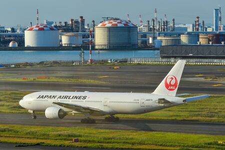 Tokyo, Japan - Nov 2, 2019. JA8979 Japan Airlines Boeing 777-200 taxiing on runway of Tokyo Haneda Airport (HND). Haneda handled 87,098,683 passengers in 2018.のeditorial素材