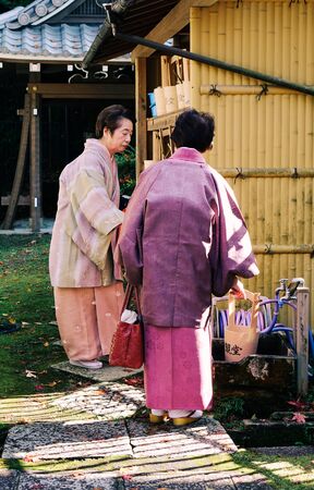 Kyoto, Japan - Nov 28, 2016. Old ladies wearing kimono dress and visiting the ancient Buddhist pagoda in Kyoto, Japan.のeditorial素材