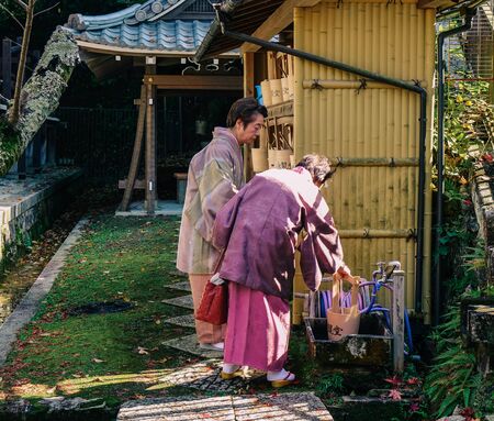 Kyoto, Japan - Nov 28, 2016. Old ladies wearing kimono dress and visiting the ancient Buddhist pagoda in Kyoto, Japan.のeditorial素材