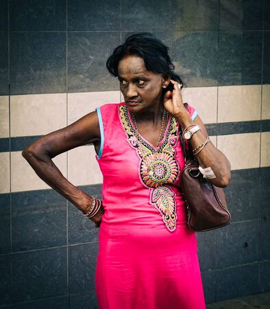 Mahebourg, Mauritius - Jan 4, 2017. Portrait of Indian woman in Mahebourg, Mauritius. Mauritius is a beautiful archipelago in Southern Africa in the Indian Ocean.のeditorial素材