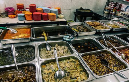 KL, Malaysia - Jan 16, 2017. Food trays at cheap restaurant in Kuala Lumpur, Malaysia. Kuala Lumpur is the cultural, financial and economic centre of Malaysia.のeditorial素材