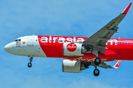 Singapore - Mar 27, 2019. 9M-AGR AirAsia Airbus A320 NEO landing at Changi Airport (SIN). Changi serves more than 100 airlines flying to 400 cities.のeditorial素材