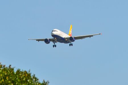 Singapore - Mar 27, 2019. Drukair (Royal Bhutan Airlines) Airbus A319 landing at Changi Airport (SIN). Changi serves more than 100 airlines flying to 400 cities.のeditorial素材