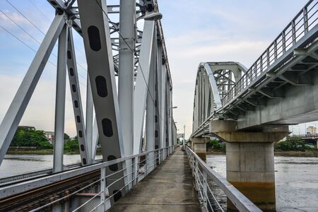 Ancient Binh Loi Railway Bridge in Saigon, Vietnam. The bridge, 276m long with six spans, was built by French contractor Levalllois Perret in 1902.のeditorial素材