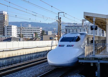 Osaka, Japan - Jan 1, 2016. train stopping at railway station in Osaka, Japan. The trains are the fastest way to discover all of Japan, reaching a speed of 320 kmh.のeditorial素材