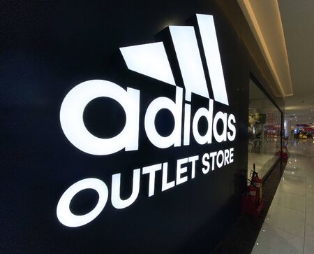 Saigon, Vietnam - Jan 15, 2020. Adidas sign at the entrance to the store in Gigamall Shopping Center...
