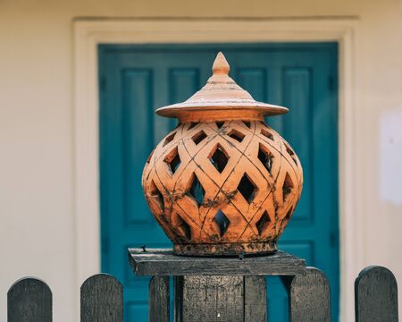 Ceramic lantern on the fence of rural house in Luang Prabang, Laos.の写真素材