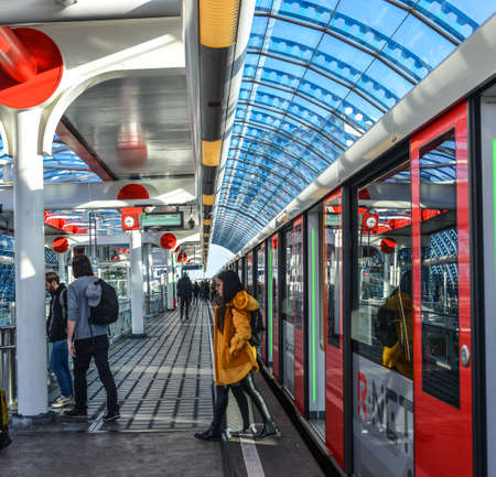 Amsterdam, Holland - Oct 7, 2018. Metro train at downtown in Amsterdam, Holland. Amsterdam known for its artistic heritage and narrow houses with gabled facades.のeditorial素材