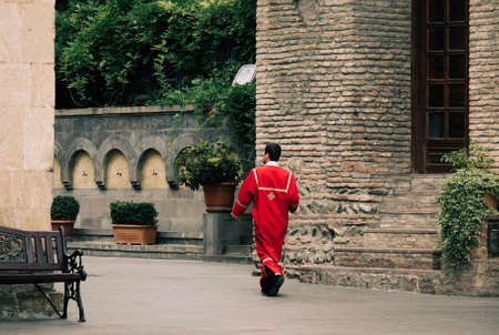 Tbilisi, Georgia - Sep 22, 2018. Priest walking at ancient church in Tbilisi, Georgia. Tbilisi is Georgia ancient and vibrant capital city spreads out on both banks of the Mtkvari River.のeditorial素材