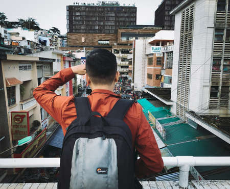 Dalat, Vietnam - Oct 27, 2019. Asian man visiting the old town in Dalat, Vietnam. With cool air,...