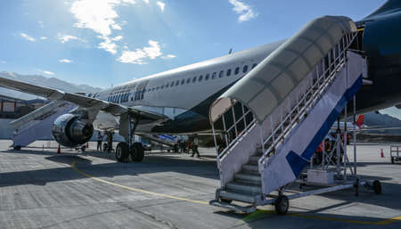 Leh, India - Jul 15, 2015. GoAir airplane docking at Kushok Bakula Rimpochee Airport. It is the...