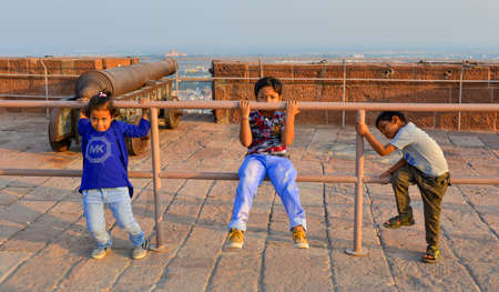Jodhpur, India - Nov 7, 2017. Children playing at Mehrangarh Fort in Jodhpur, India. Built in the 15th century, the fort is now a popular destination in Rajasthan.のeditorial素材