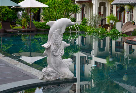 Hoi An, Vietnam - Jul 20, 2018. Swimming pool of luxury resort in Hoi An, Vietnam. Hoi An is a city on central coast known for its well-preserved Ancient Town.のeditorial素材