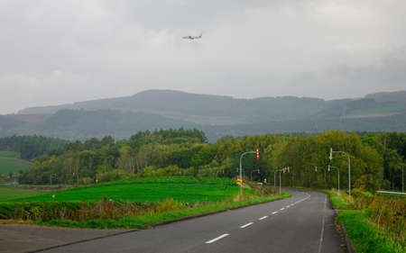 Rural road at summer day in Furano, Japan. Furano known for the pleasant and picturesque rural landscapes.の写真素材