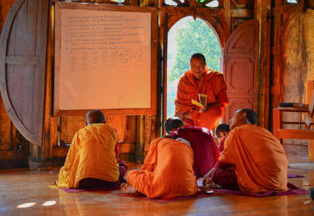 Nyaung Shwe, Myanmar - Feb 8, 2017. Novice monks studying at the ancient monastery. In Burma, becoming a novice monk is a great honour for families.のeditorial素材