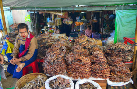 Taunggyi, Myanmar - Feb 8, 2017. Selling salty fish at rural market in Taunggyi, Myanmar. Taunggyi is the largest city in Shan State, famous for its multi-ethnic markets.のeditorial素材