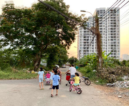 Saigon, Vietnam - Jan 26, 2021. Children playing on street of Saigon, Vietnam. Saigon is a dynamic city and the largest economic center in Vietnam.のeditorial素材
