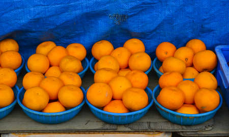 Selling orange on street market in Nara, Japan.の写真素材